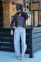 Casual Form Pocket Barrel Leg Jeans in light wash outdoors with a striped top