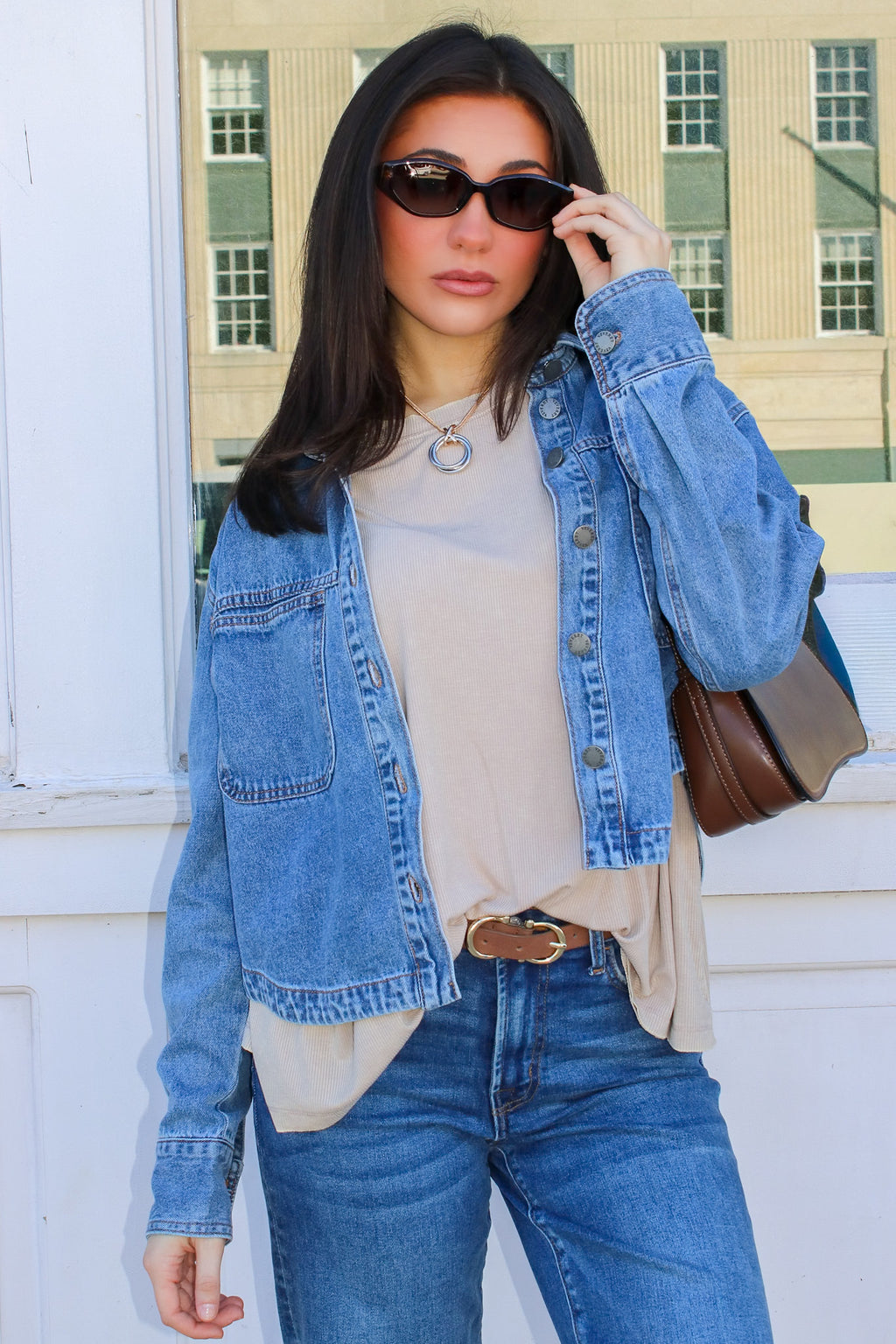 Faded Signal Denim Shacket in taupe under a denim jacket with jeans