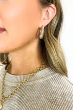 Gleam Twist Oval Huggie Hoop Earrings - Madison and Mallory