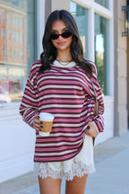 Soft Standard Striped Pullover in berry stripe outdoors with a coffee